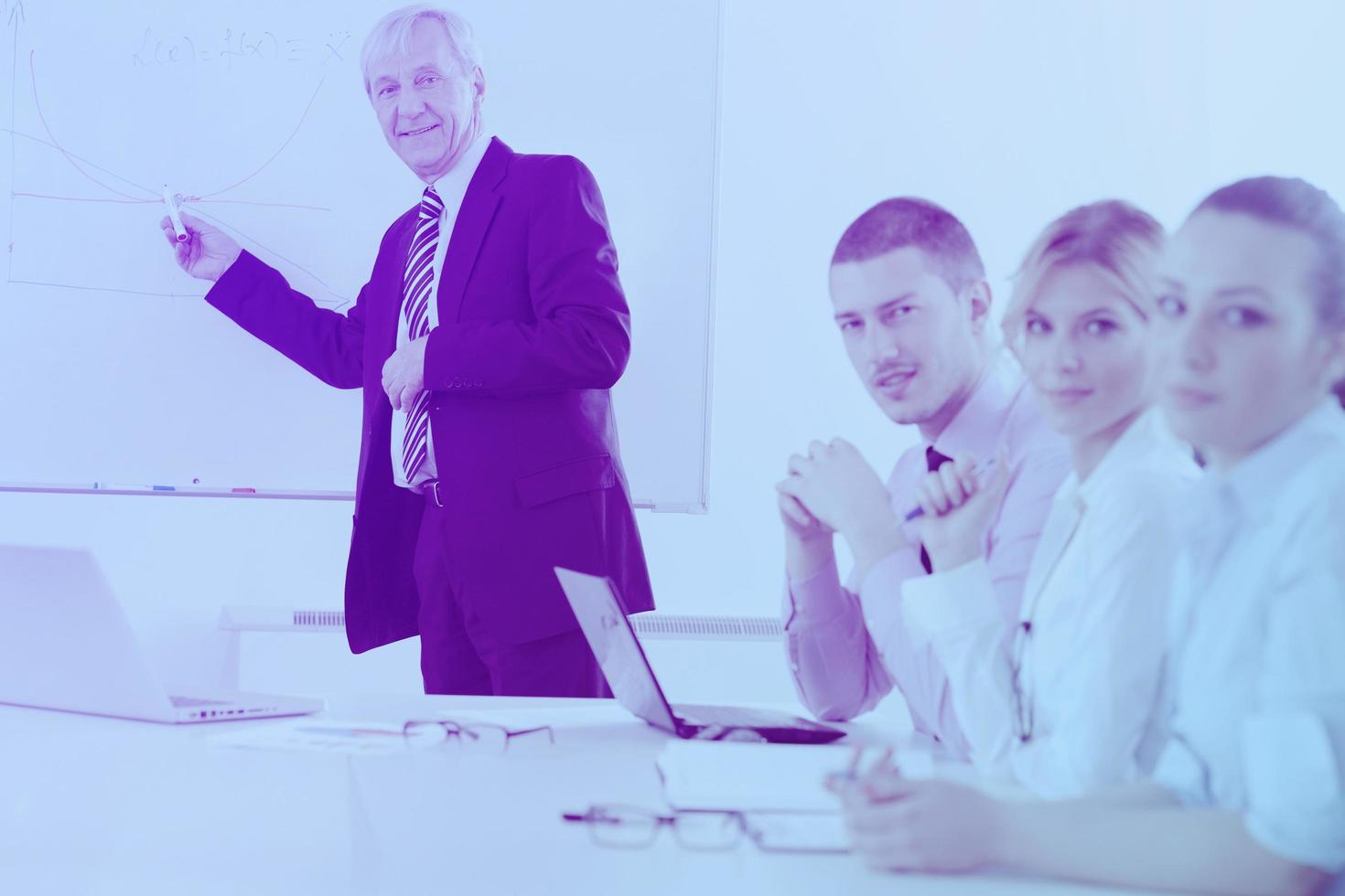 Senior business man giving a presentation photo