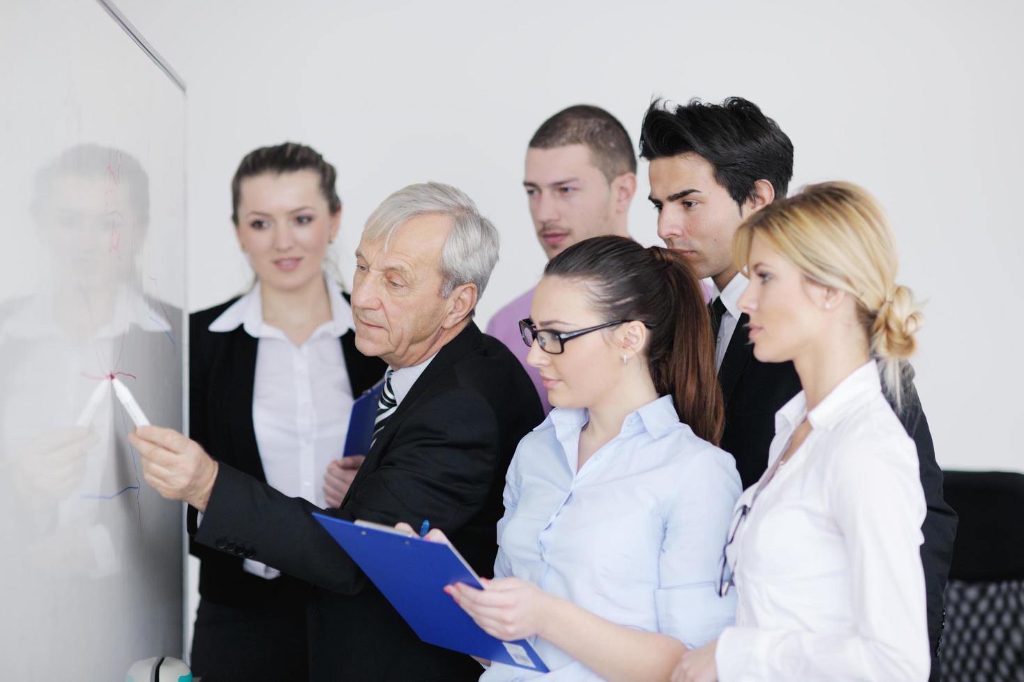 Senior business man giving a presentation photo