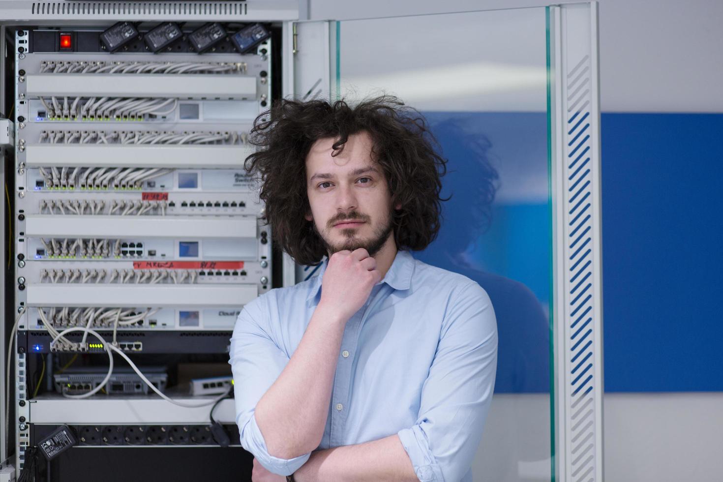 business man engeneer in datacenter server room photo