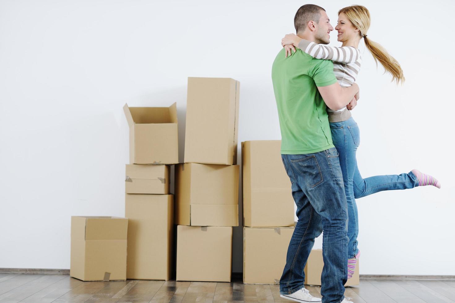 Young couple moving in new house photo
