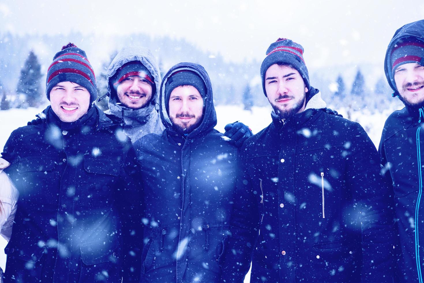 portrait of group young people in beautiful winter landscape photo