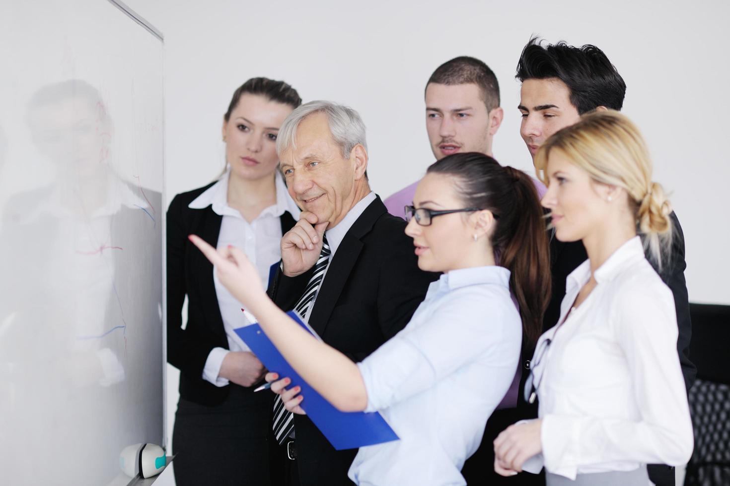 Senior business man giving a presentation photo