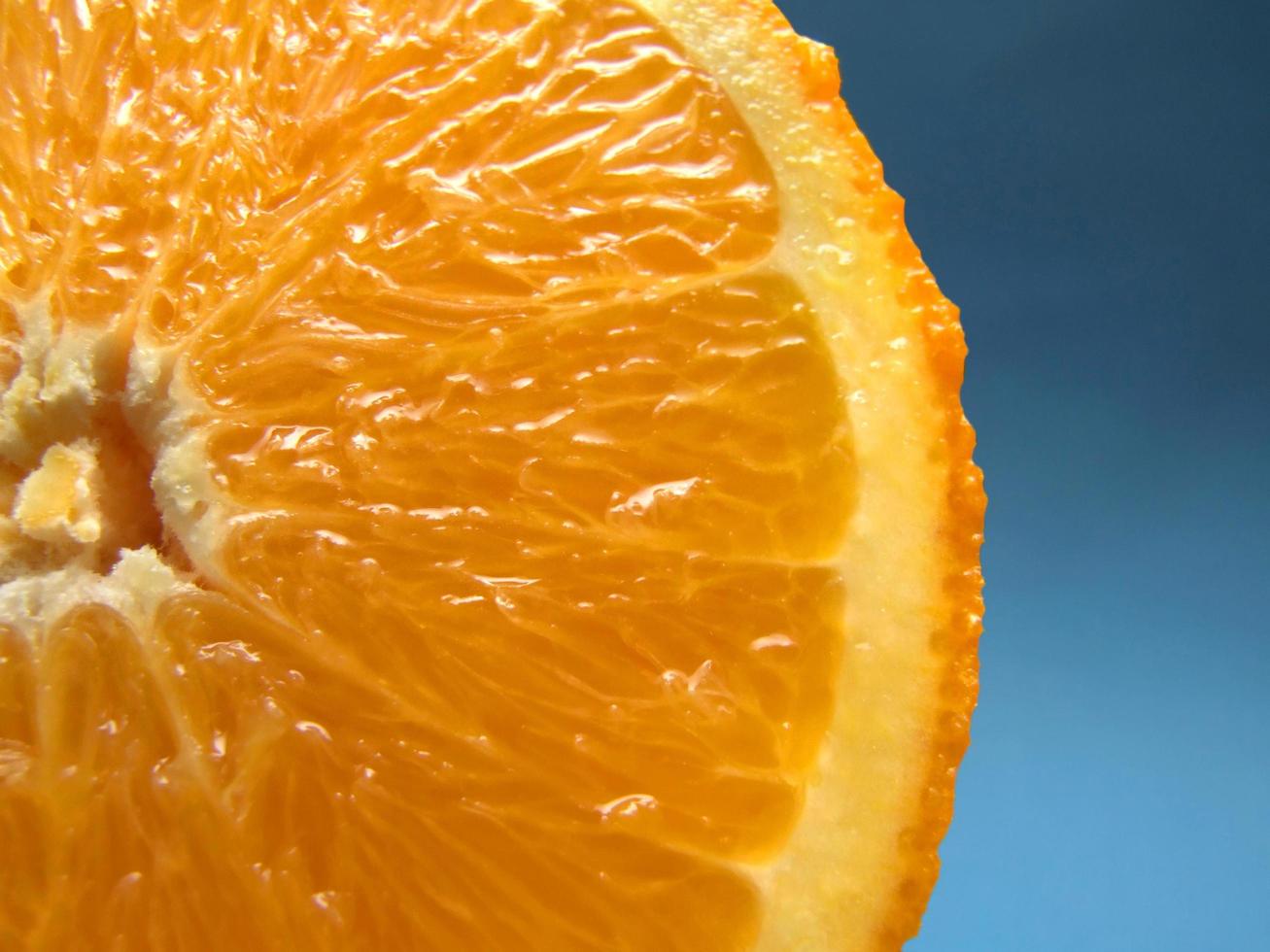 sliced orange macro with blue background 12092779 Stock Photo at Vecteezy