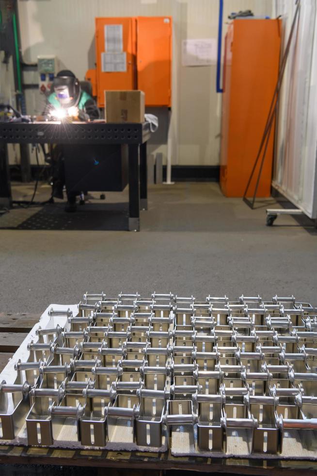 Turkey, 2022 - The first phase of metal and aluminum processing. Processed products from CNC machines stacked on a pallet in a large modern factory photo