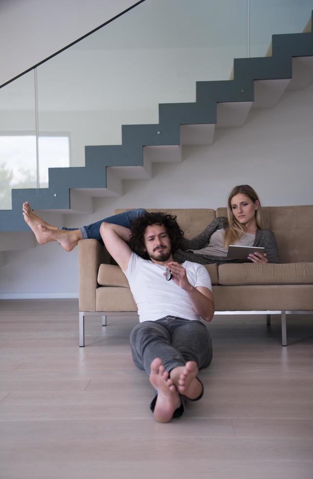 young couple relaxes in the living room photo