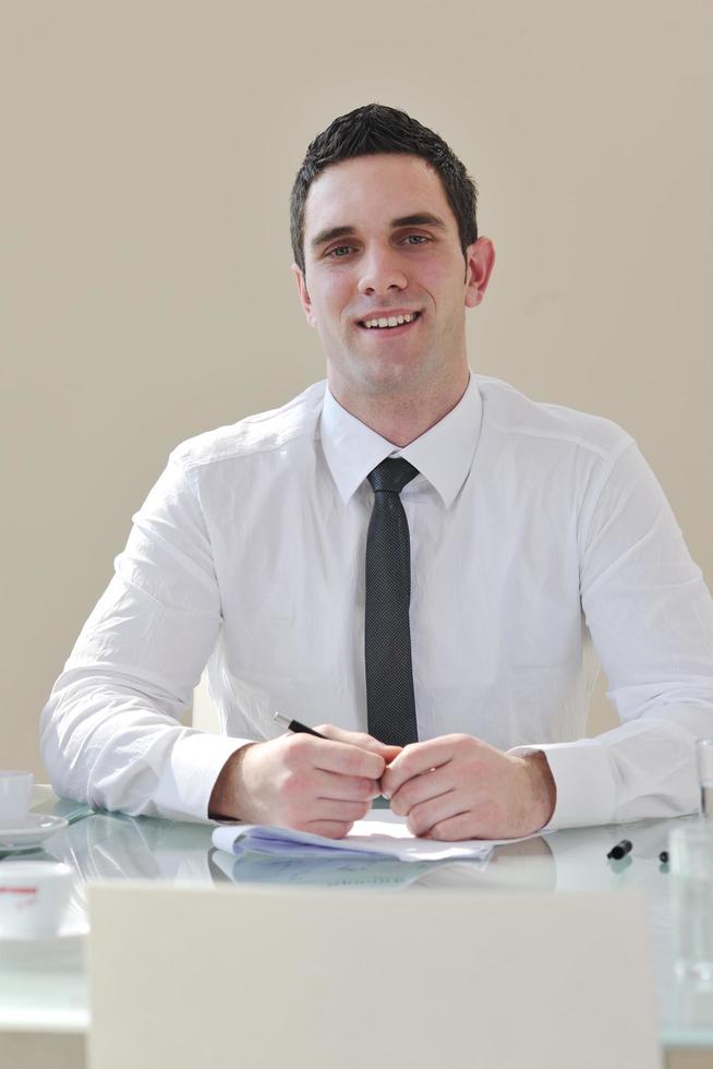 young business man alone in conference room photo