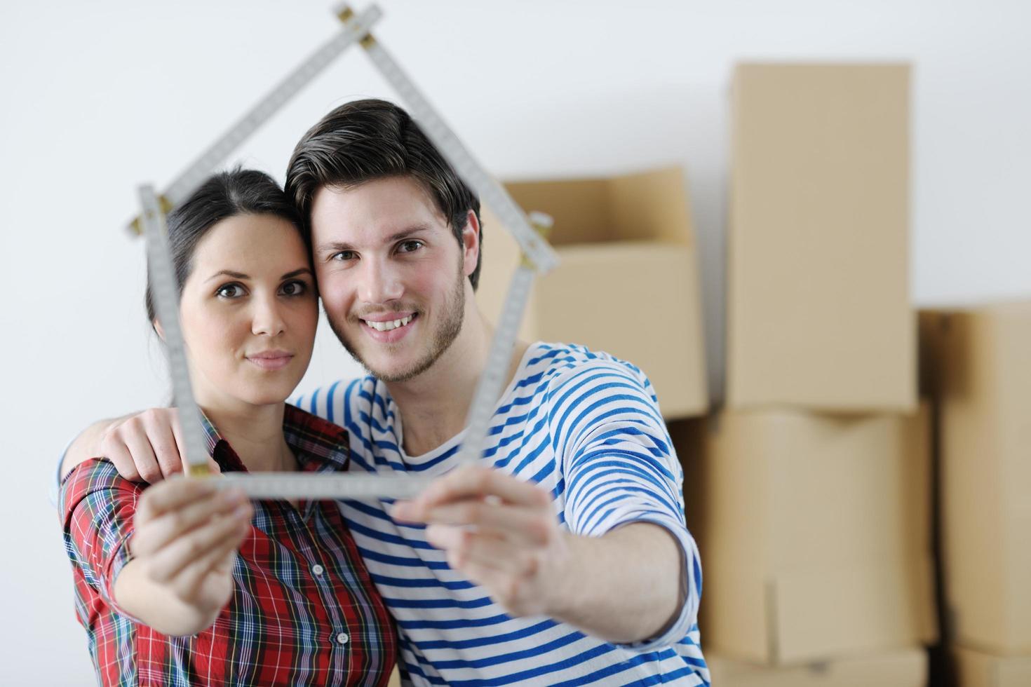 Young couple moving in new house photo
