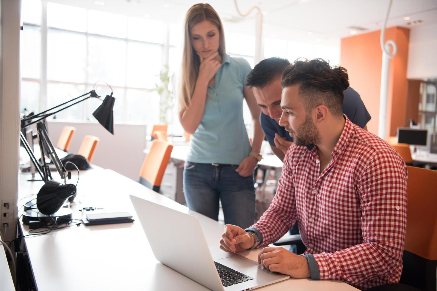 Group of young people employee workers with computer photo