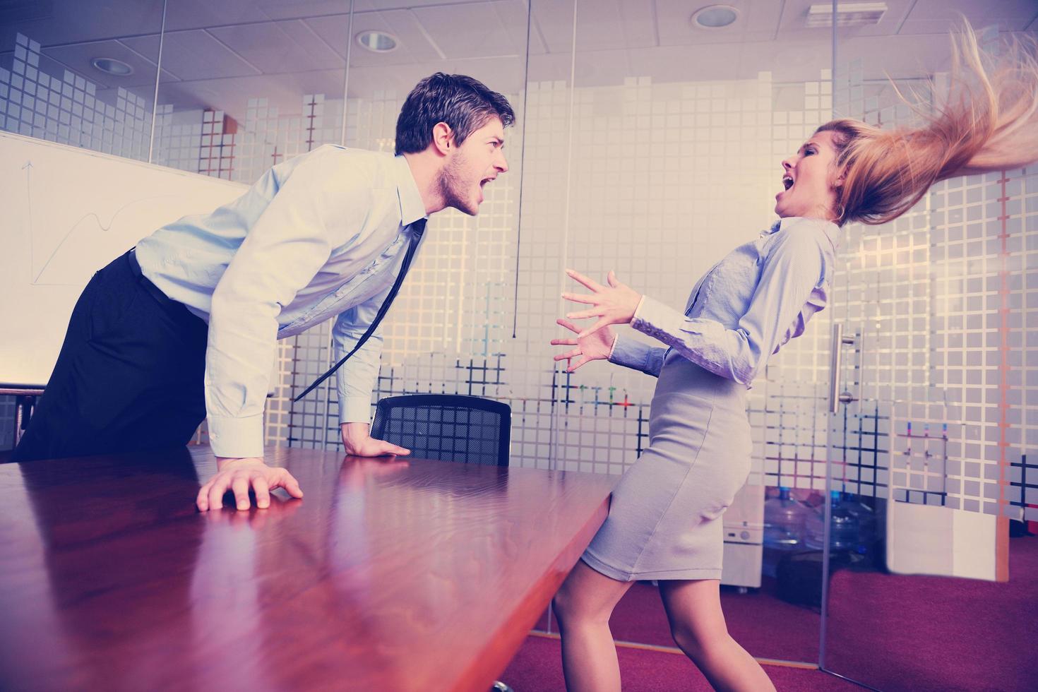 Angry busines sman screaming at employee photo