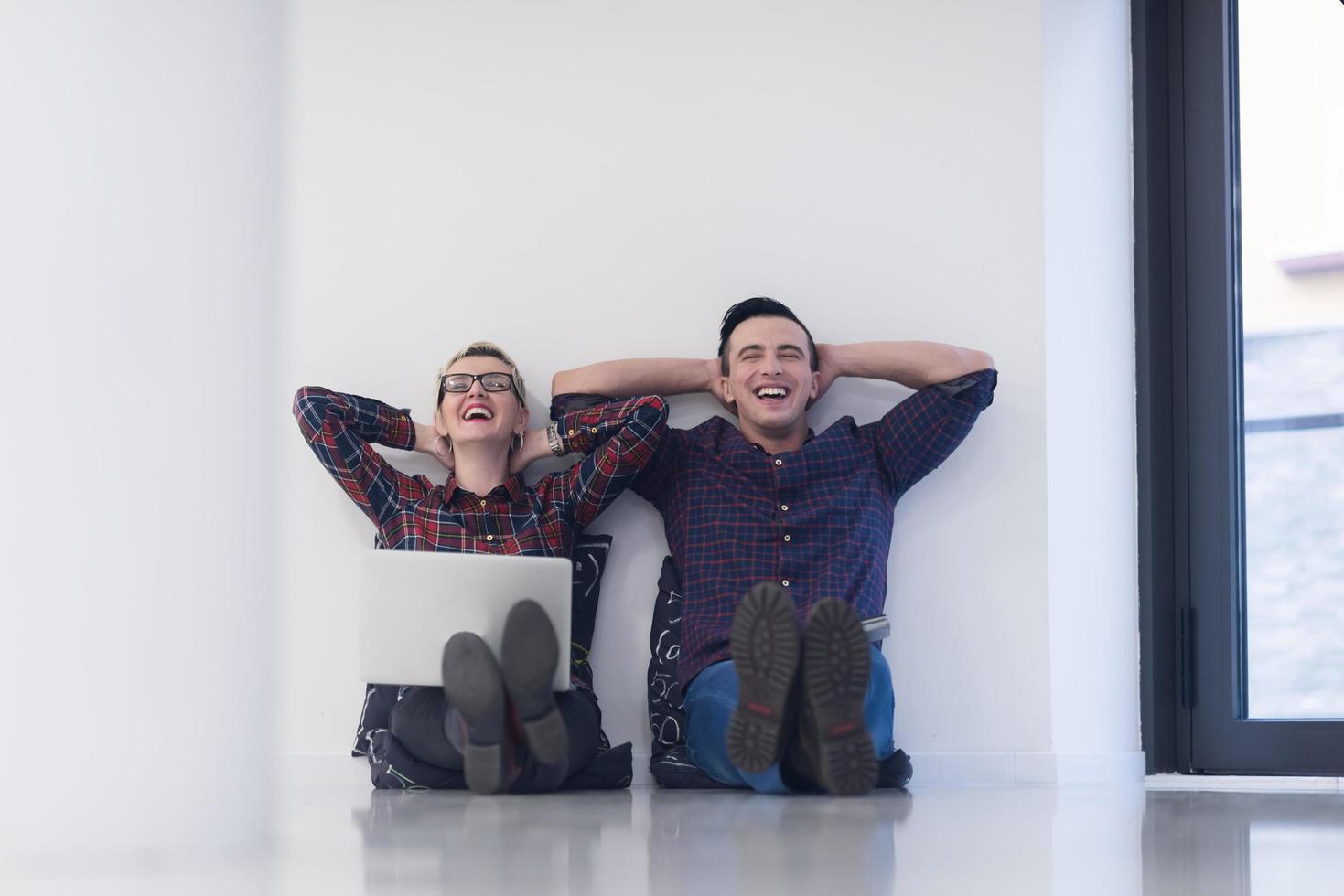 startup business, couple working on laptop computer at office photo