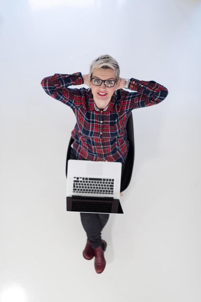 top view of young business woman working on laptop computer photo