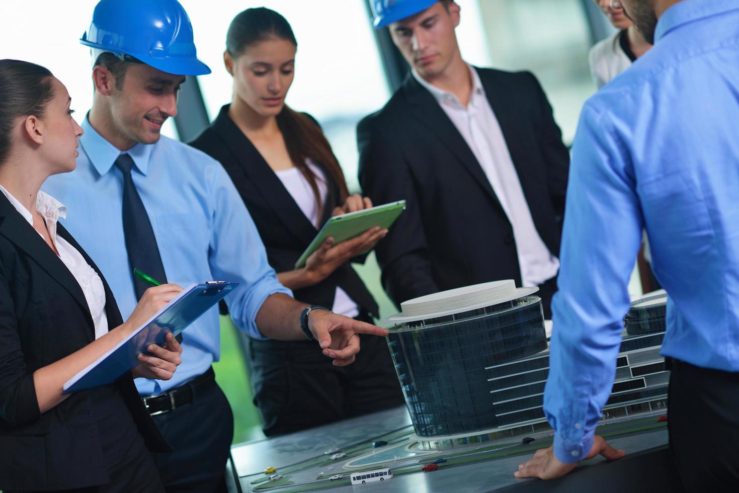 business people and engineers on meeting photo