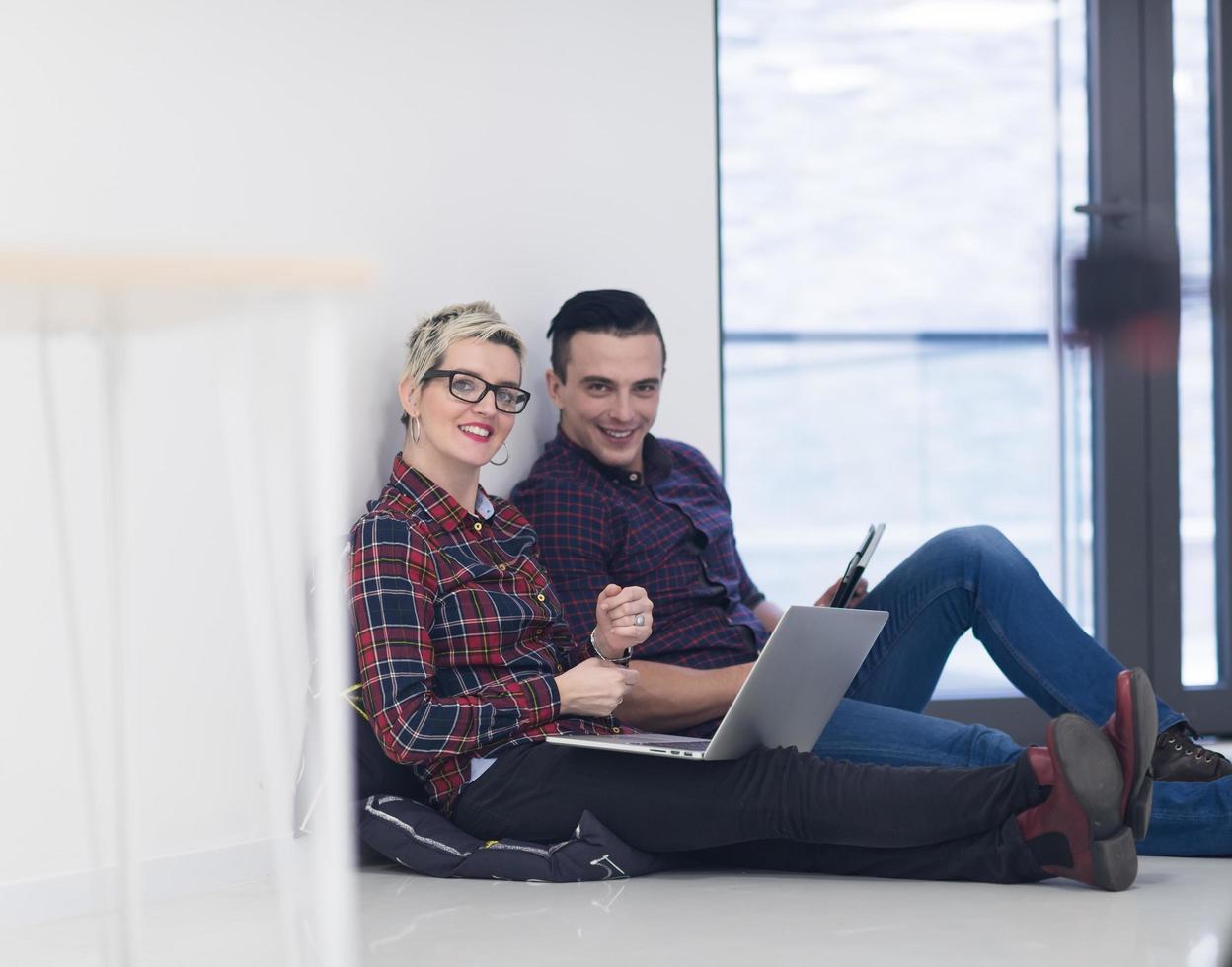 startup business, couple working on laptop computer at office photo