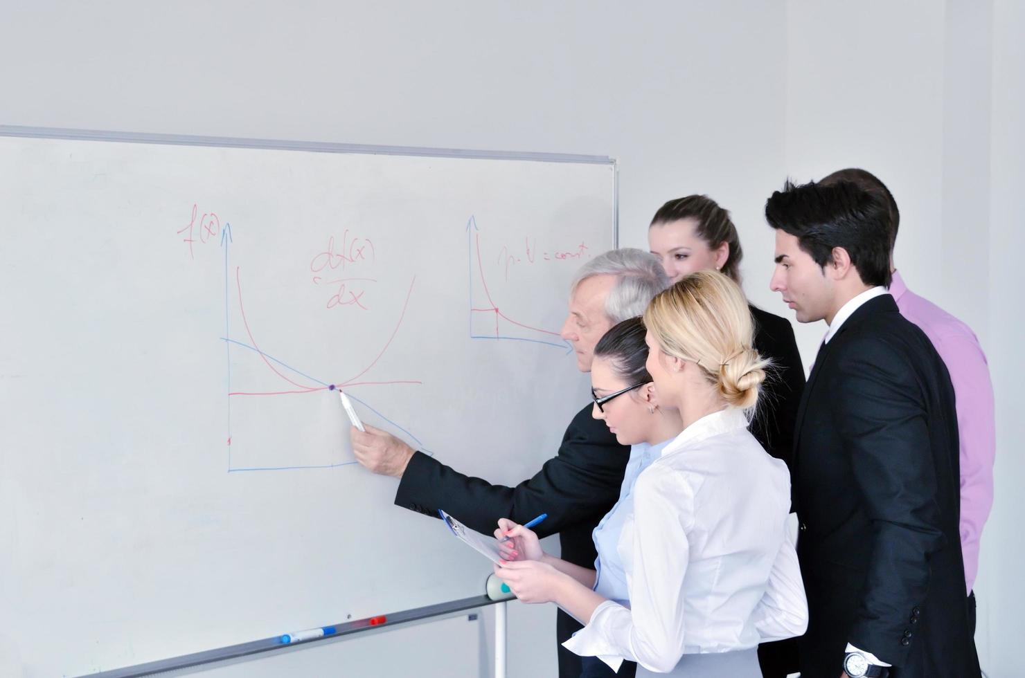 Senior business man giving a presentation photo