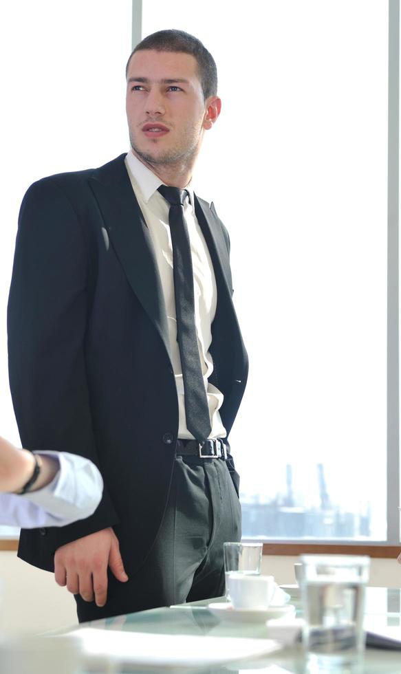 young business man alone in conference room photo