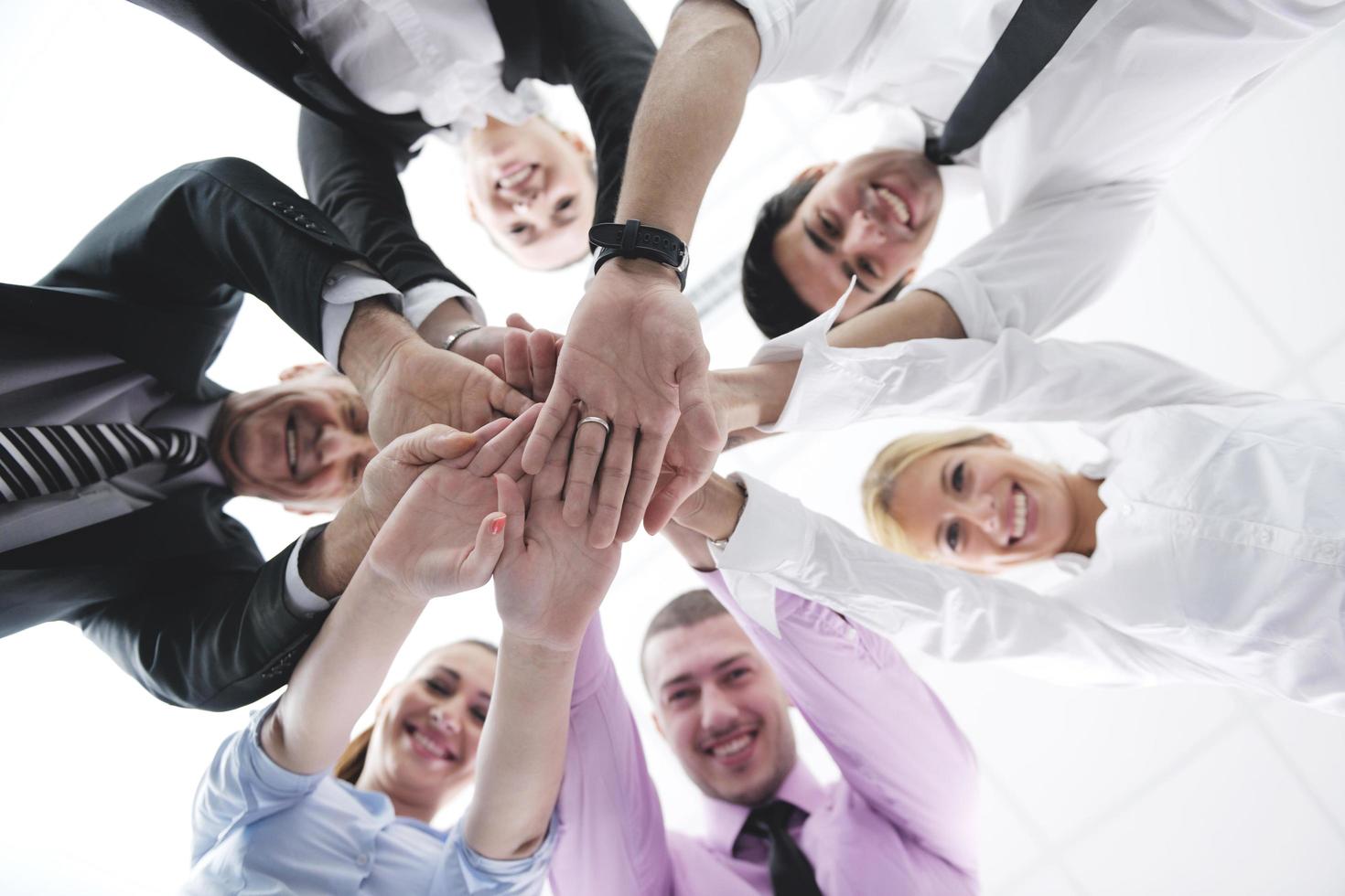 business people group joining hands photo