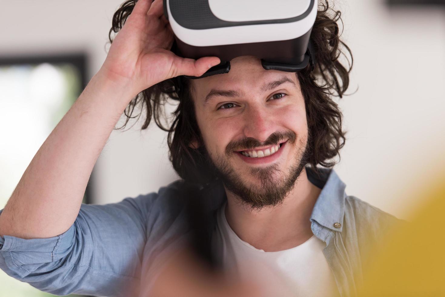 man using VR-headset glasses of virtual reality photo