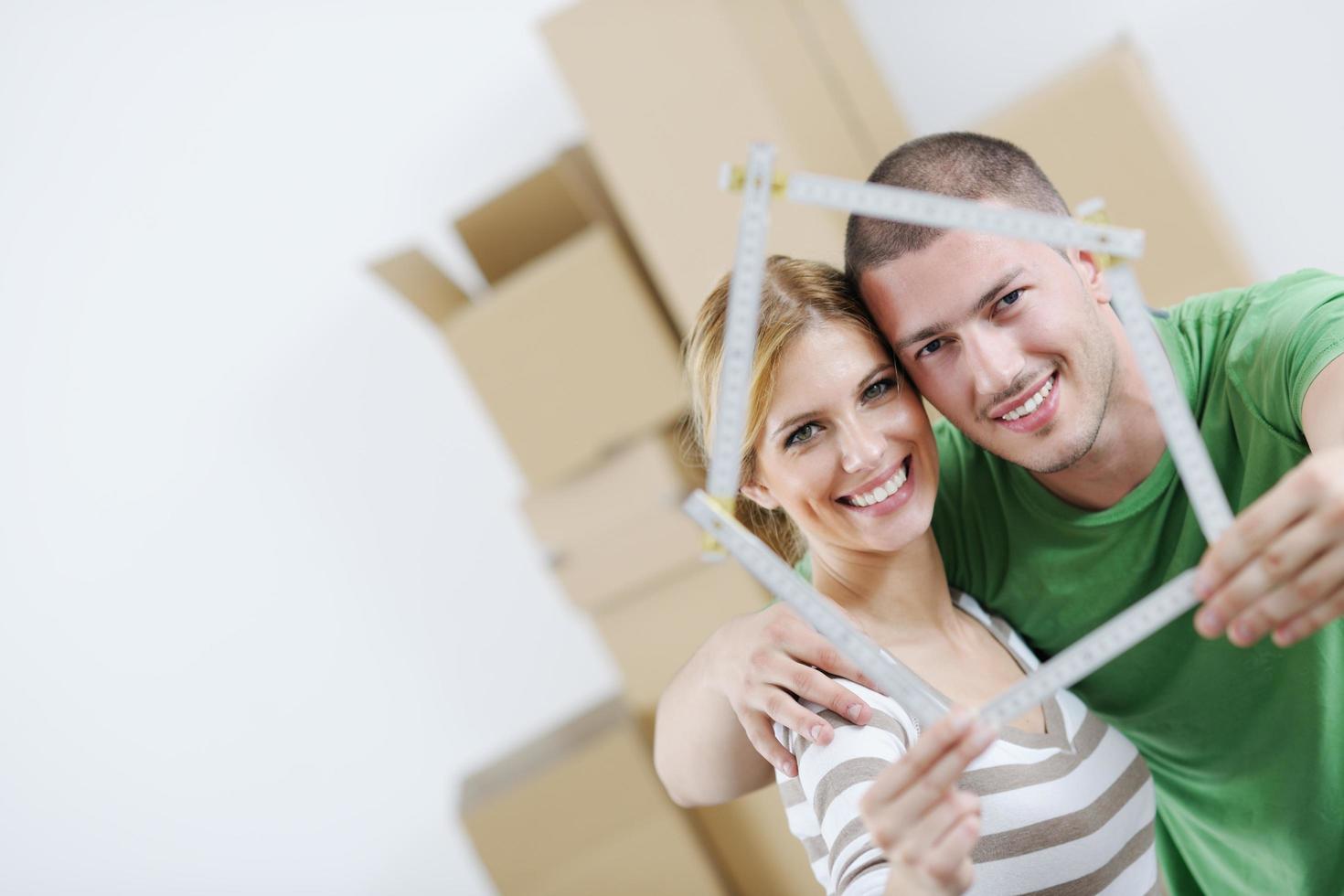 Young couple moving in new house photo