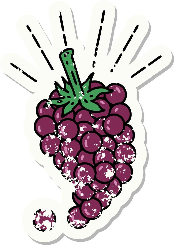 worn old sticker of a tattoo style bunch of grapes vector