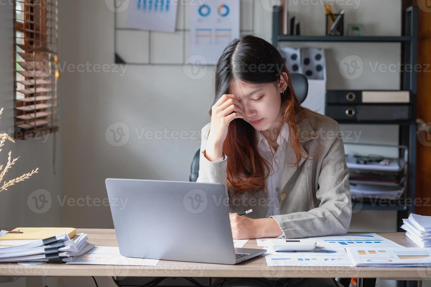 Concept Burnout Syndrome. Business Woman feels uncomfortable working. Which is caused by stress, accumulated from unsuccessful work And less resting body. Consult a specialist psychiatrist. photo