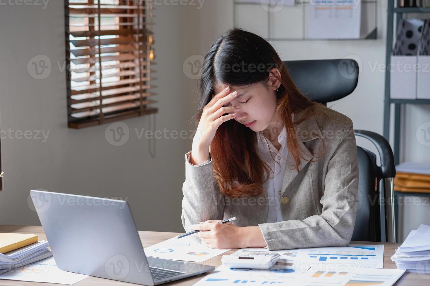 Concept Burnout Syndrome. Business Woman feels uncomfortable working. Which is caused by stress, accumulated from unsuccessful work And less resting body. Consult a specialist psychiatrist. photo