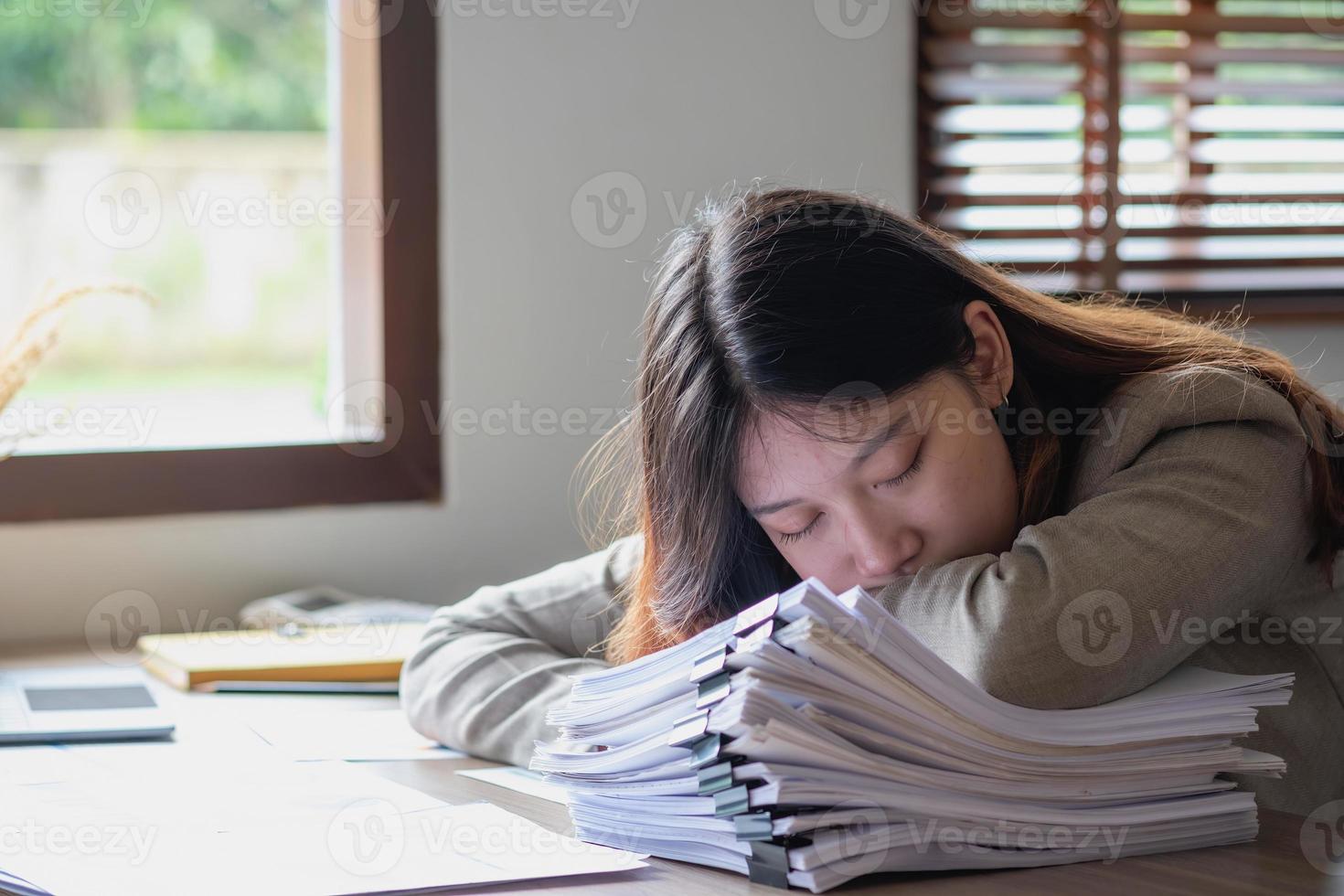 Concept Burnout Syndrome. Business Woman feels uncomfortable working. Which is caused by stress, accumulated from unsuccessful work And less resting body. Consult a specialist psychiatrist. photo