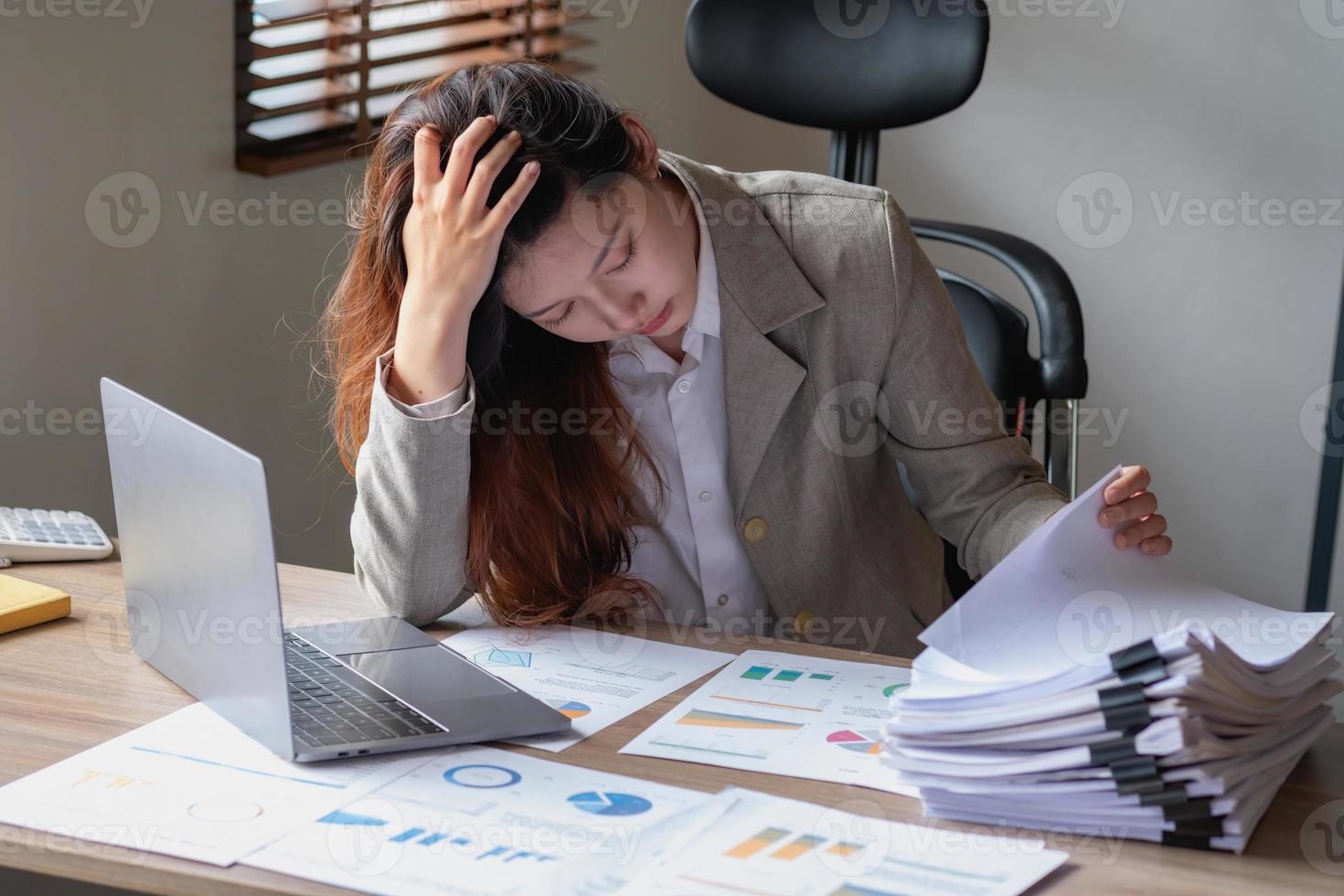 Concept Burnout Syndrome. Business Woman feels uncomfortable working. Which is caused by stress, accumulated from unsuccessful work And less resting body. Consult a specialist psychiatrist. photo