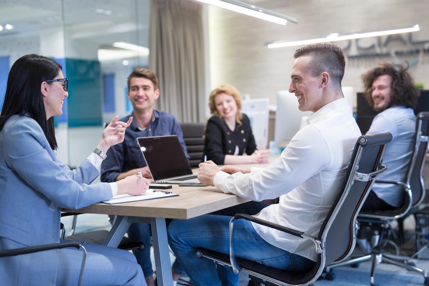 Startup Business Team At A Meeting at modern office building photo