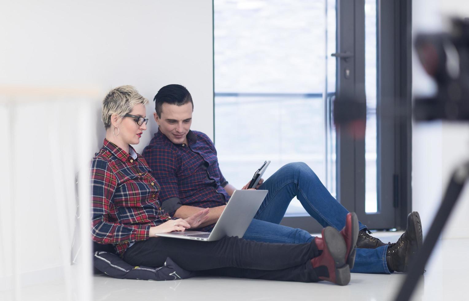 startup business, couple working on laptop computer at office photo