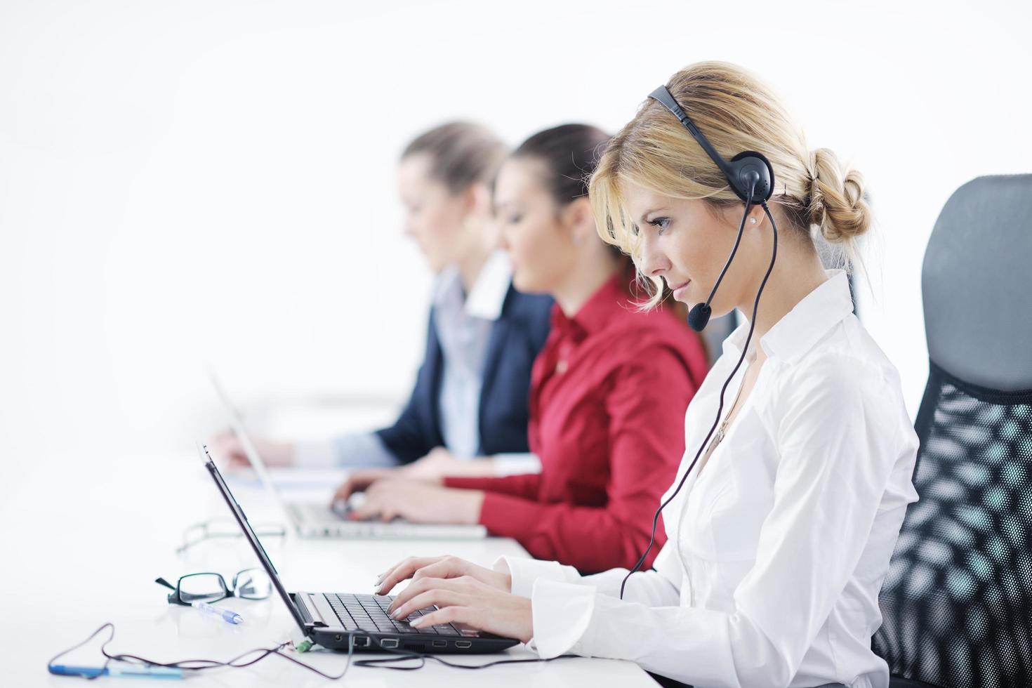 business woman group with headphones photo