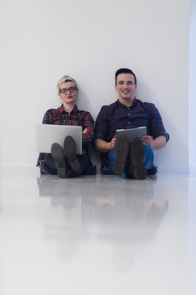 startup business, couple working on laptop computer at office photo