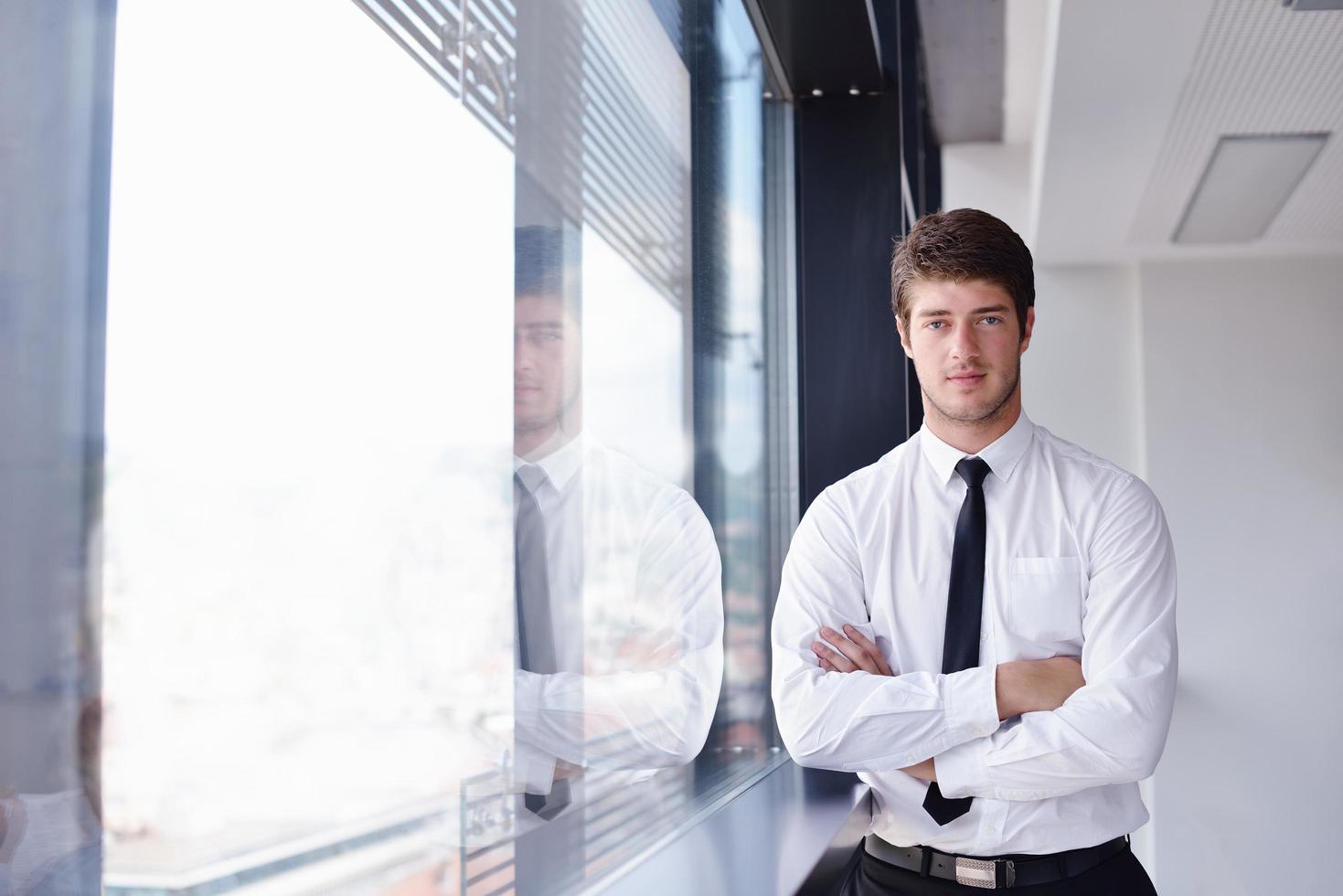 Young pretty business woman with notebook in the office photo