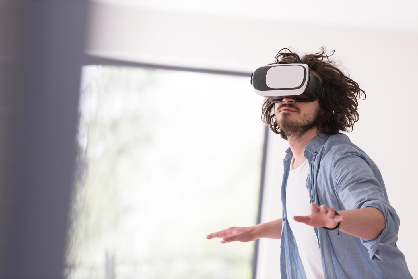 man using VR-headset glasses of virtual reality photo