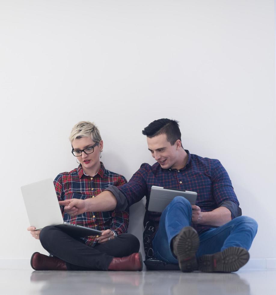startup business, couple working on laptop computer at office photo