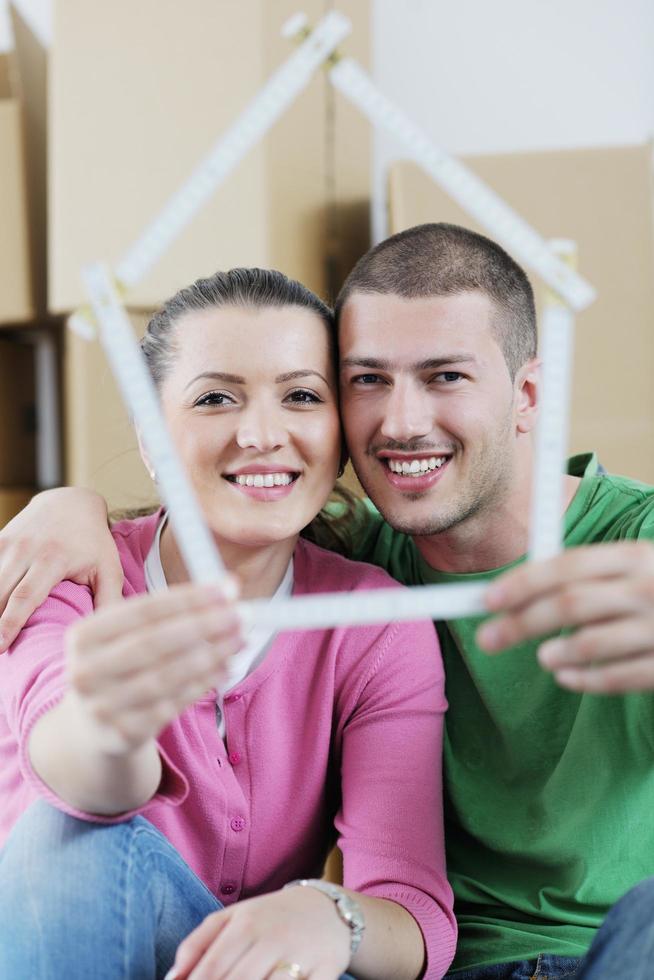 Young couple moving in new house photo