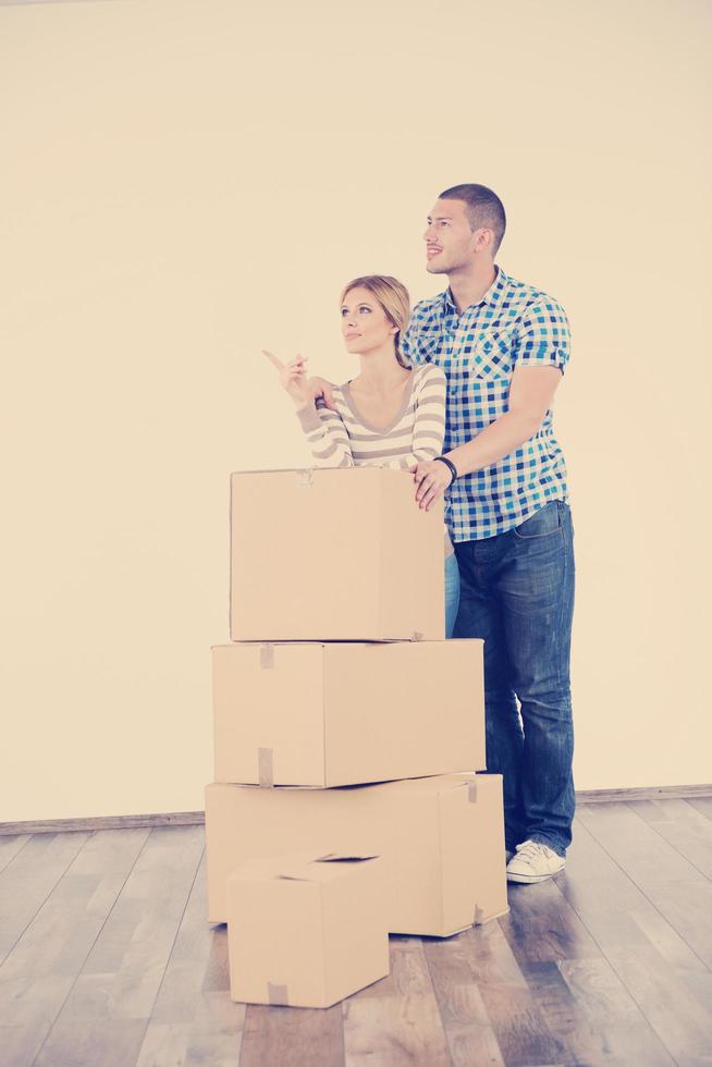 Young couple moving in new house photo