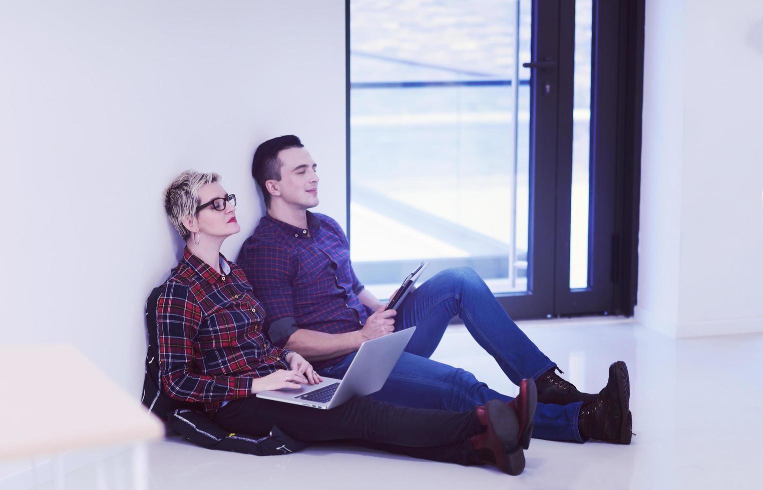 startup business, couple working on laptop computer at office photo
