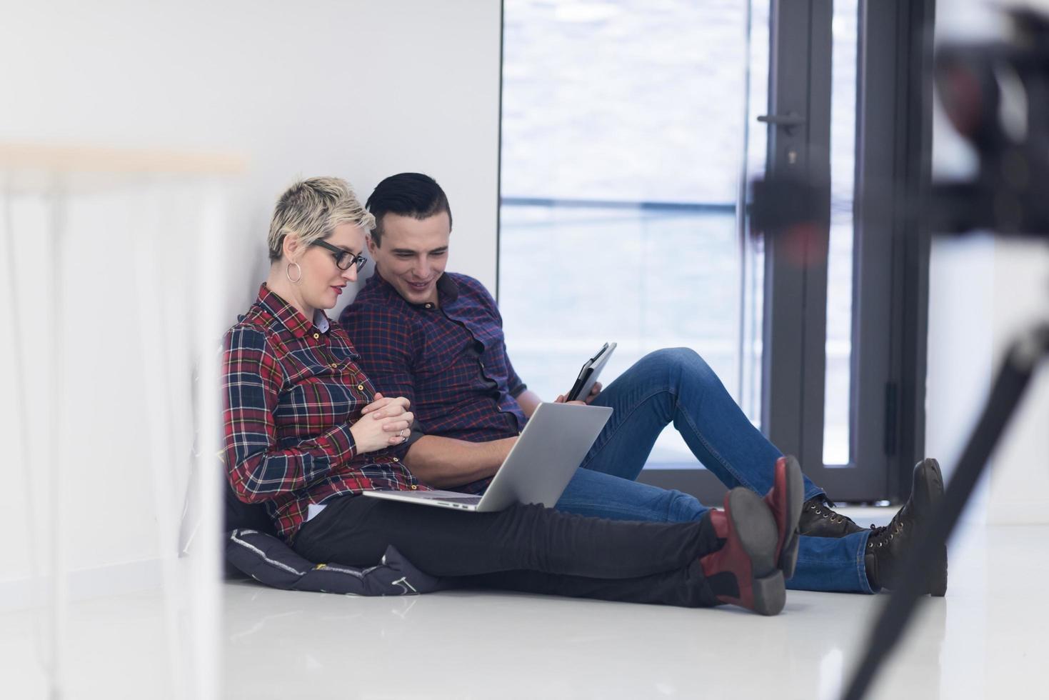 startup business, couple working on laptop computer at office photo