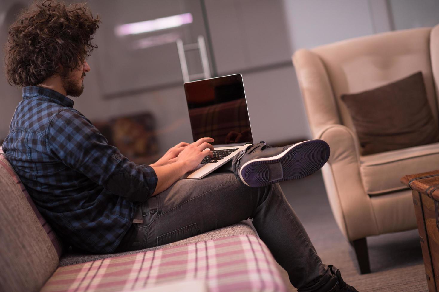 man working with laptop photo