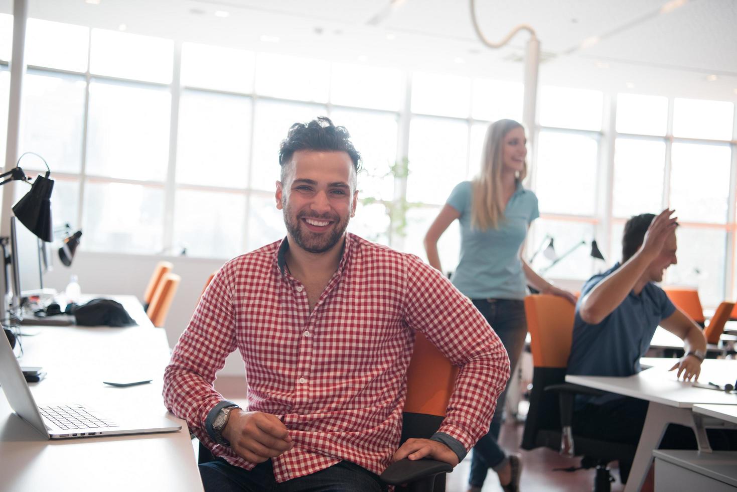 Portrait of young informal businessman photo