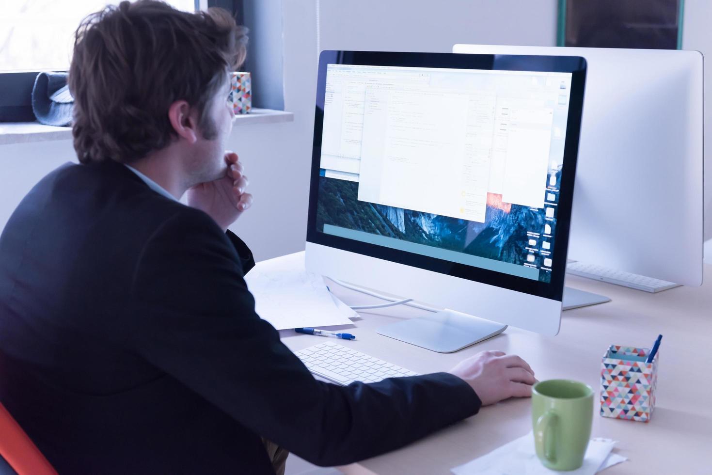 startup business, software developer working on computer photo
