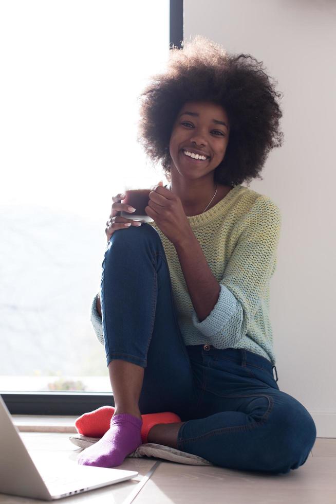 black woman in the living room on the floor photo