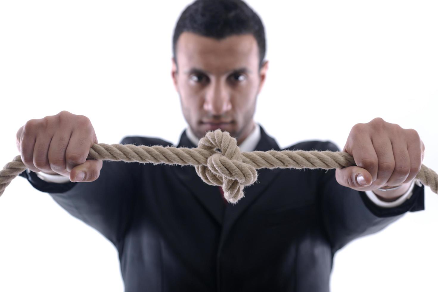 business man with rope isolated on white background photo