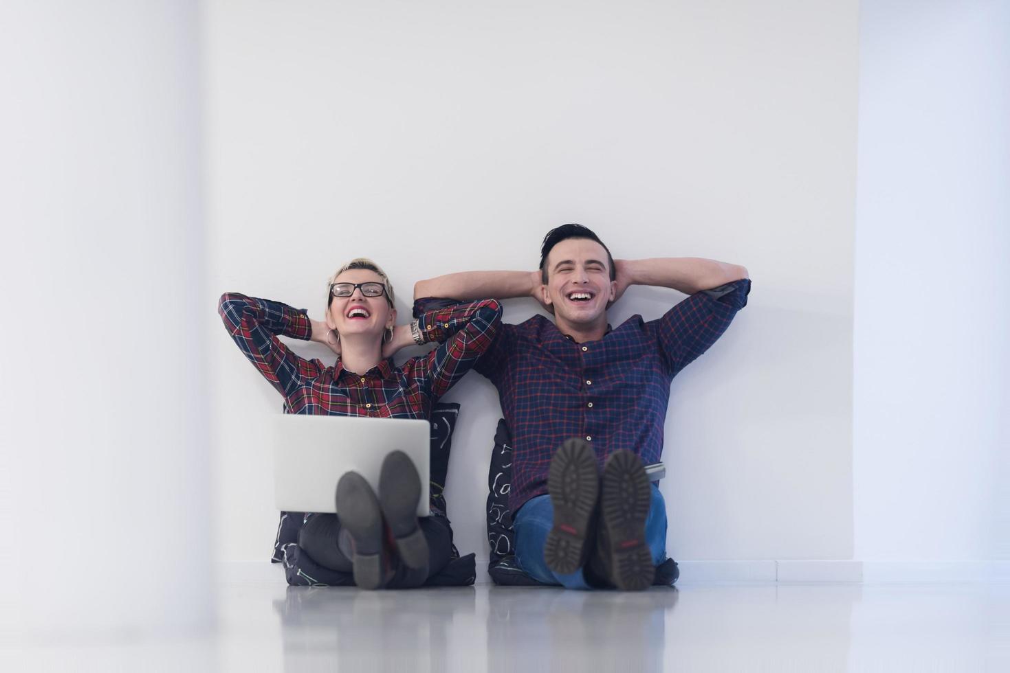 startup business, couple working on laptop computer at office photo