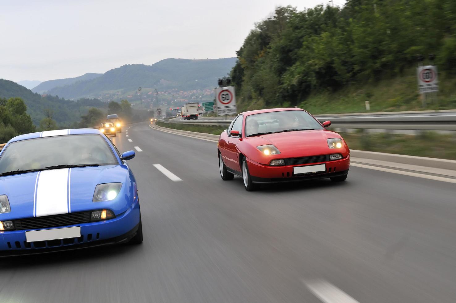 Tuning cars sacing down the highway photo