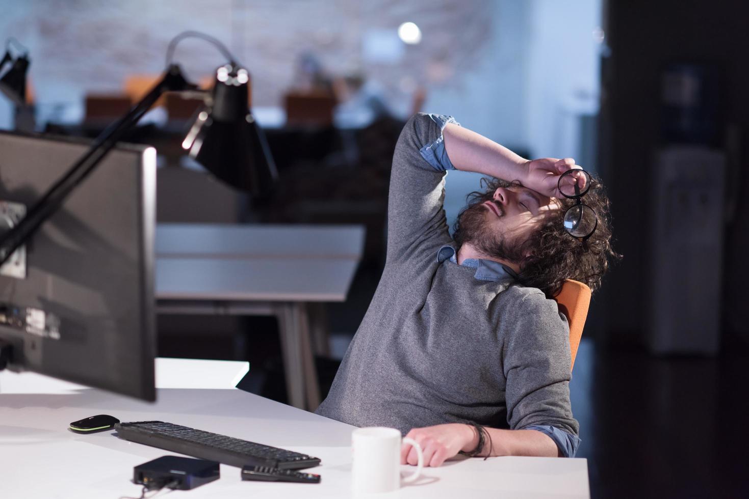 businessman relaxing at the desk photo