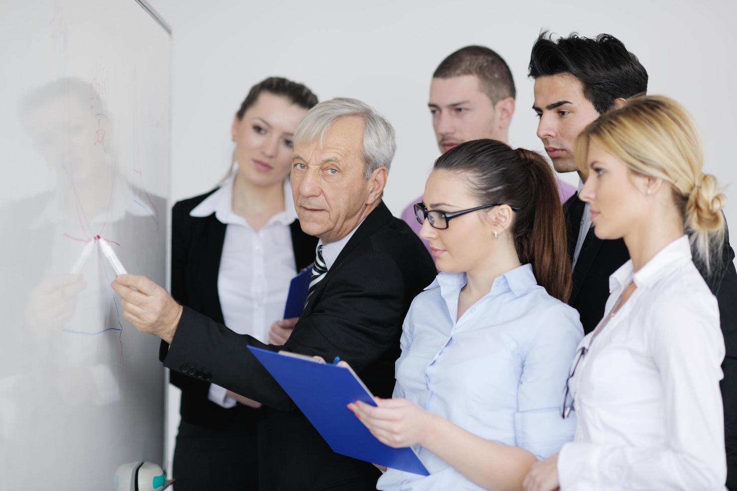 Senior business man giving a presentation photo