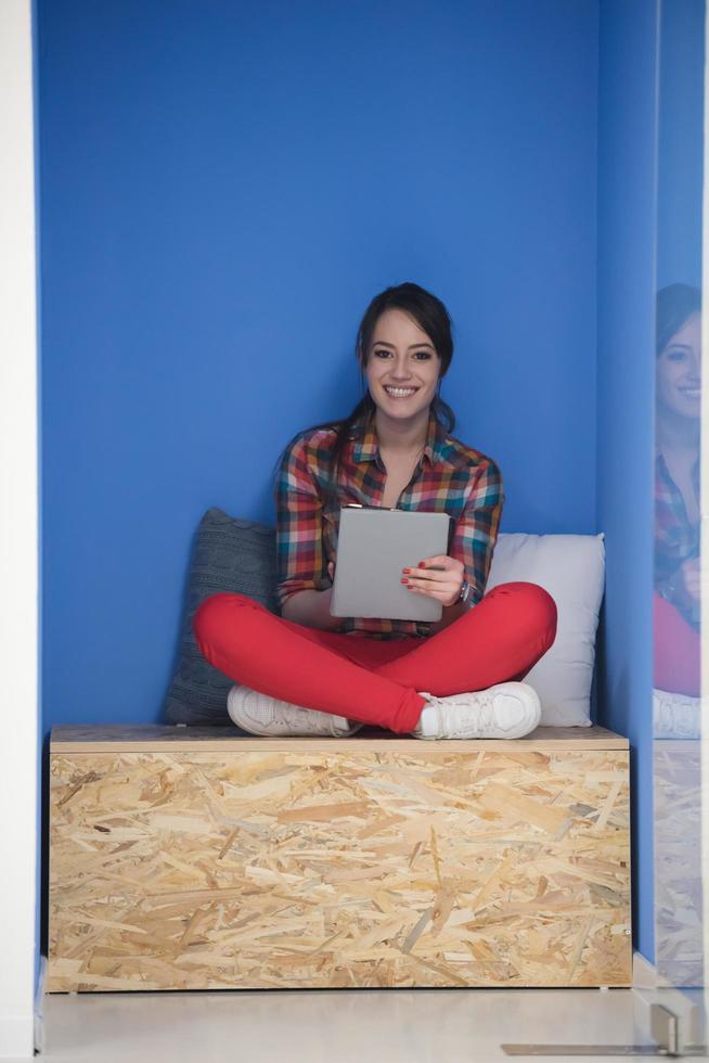 woman in crative box working on tablet photo