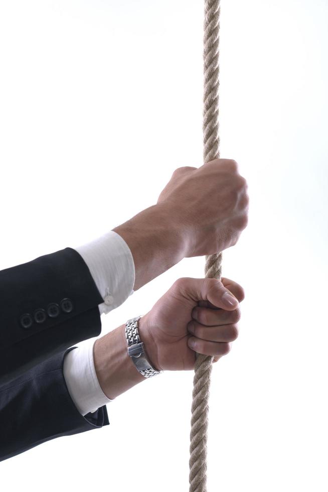 business man with rope isolated on white background photo