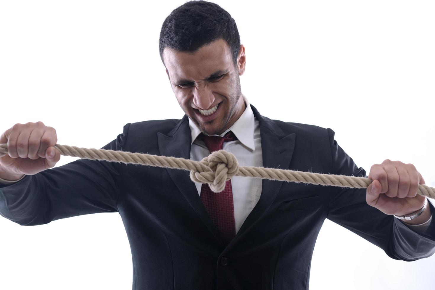 business man with rope isolated on white background photo